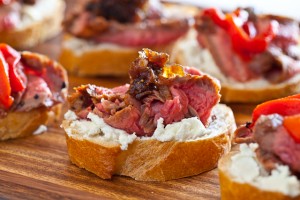 Flank steak with goat cheese on toast