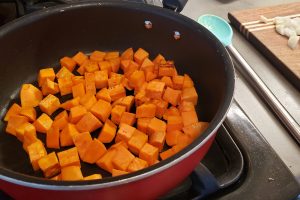 Sweet potato cubes sauteing in skillet
